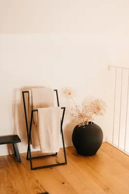 a room with two chairs and a vase on the floor at Grad Štanjel House in Štanjel