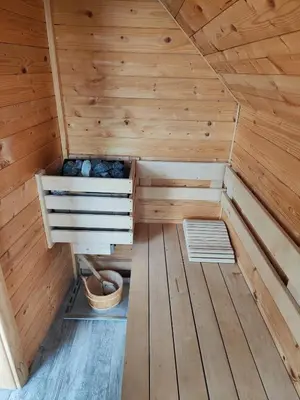 a wooden sauna with a bench in the middle at APARTMA-SPA NATURA in Sveti Jurij ob Ščavnici