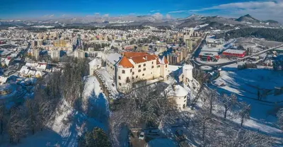 an aerial view of a city in the snow at Apartma Knap Velenje in Velenje