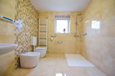 a bathroom with a shower and a toilet and a sink at Holiday Home Toplica Natura with natural thermal Bath in Cerklje ob Krki