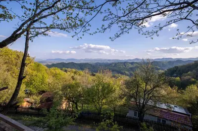 a view of the mountains from a house at Hiška pod Rudnico 2 in Podčetrtek