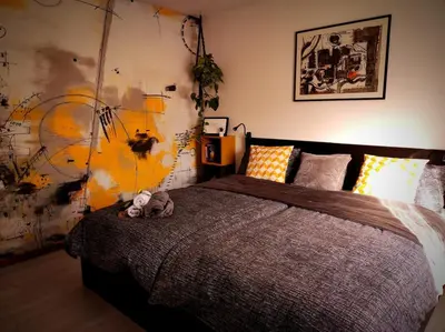 a bedroom with a bed with a stuffed animal on it at Moksha Slovenia in Tolmin