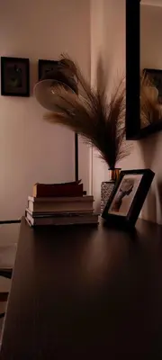 a pile of books sitting on top of a table at Moksha Slovenia in Tolmin