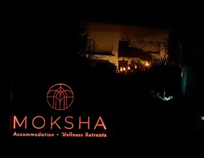 a sign that says moska with a building in the background at Moksha Slovenia in Tolmin