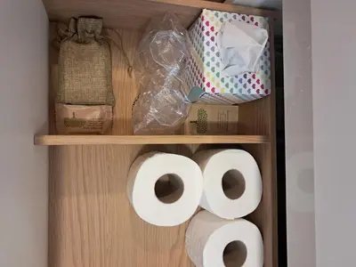 a bunch of rolls of toilet paper on a shelf at Apartma Lida 2 in Bled