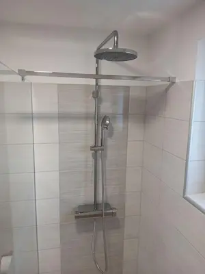 a shower with a shower head in a bathroom at Apartma Lida 2 in Bled