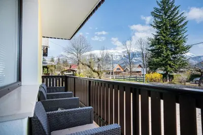 a balcony with chairs and a view of the mountains at Apartma Lida 1- mirna lokacija, brezplačno parkirišče, 10 minut hoje do jezera in gradu in Bled