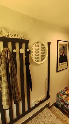 a crib in a childs room with a baseball picture on the wall at Retro in Tolmin