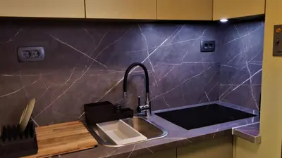 a kitchen with a sink and a counter top at Retro in Tolmin