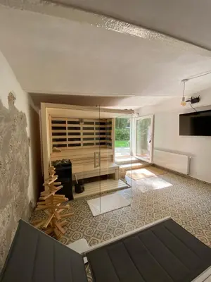 a living room with a fireplace and a large window at Historical Villa in the heart of Bled 2 in Bled