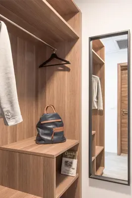 a dressing room with a mirror and a purse on a shelf at B&B Pod vrbo in Ljubljana