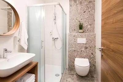 a bathroom with a sink and a toilet and a shower at B&B Pod vrbo in Ljubljana