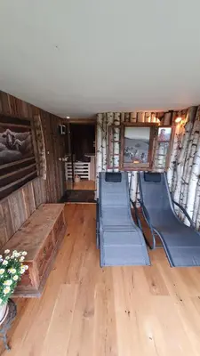 an inside view of an rv with wooden floors and stairs at Treehouse Toplak in Ruše