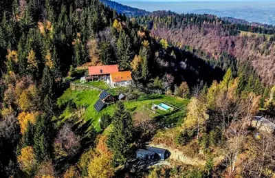 an aerial view of a house on a hill at Treehouse Toplak in Ruše