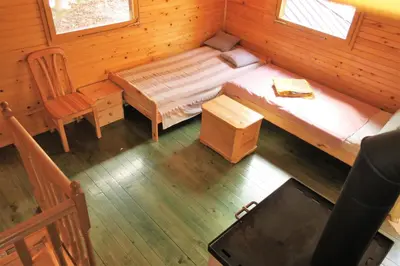 an overhead view of a bedroom with a bed and a chair at ARIA in Sviščaki