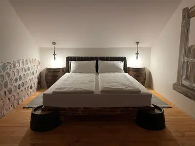 a bedroom with a large bed in a room at Vamiš in Gornji Petrovci