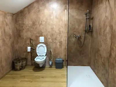 a bathroom with a toilet and a shower at Vamiš in Gornji Petrovci