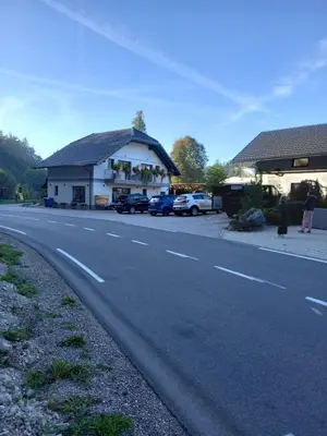 a building on the side of a road at Apartmaji Tisa in Žana in Rovte