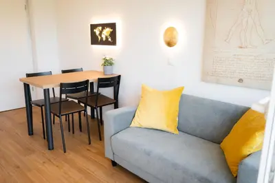 a living room with a couch and a table at APARTMENT 396 in Ljubljana