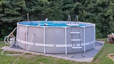a hot tub with a ladder in the grass at Apartma Moser in Podnanos