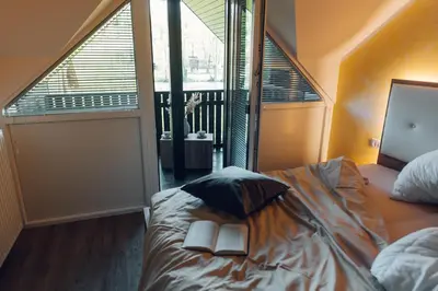 a bedroom with a bed with two books on it at Gostišče Koren in Žužemberk