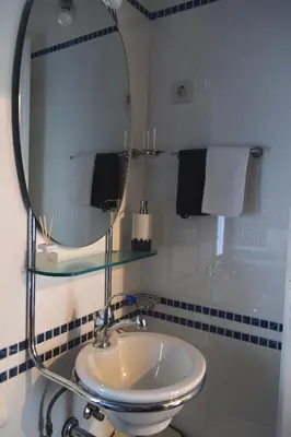 a bathroom with a sink and a mirror at Holiday Home Ribno - Bled in Bled