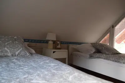 a bedroom with a bed and a window at Holiday Home Ribno - Bled in Bled