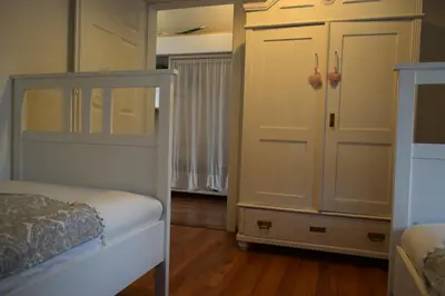 a bedroom with a bunk bed and a closet at Holiday Home Ribno - Bled in Bled