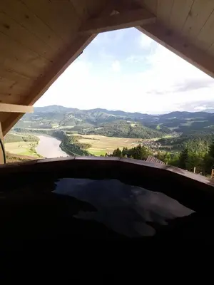 a view of a body of water from a window at Glamping hišice Orlič in Muta