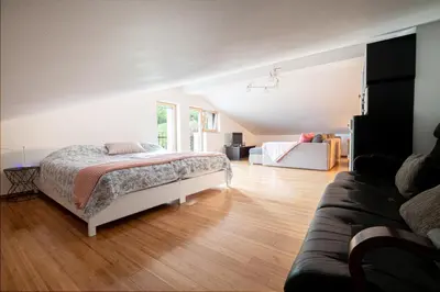 a bedroom with a bed and a couch at Villa Azul in Kojsko