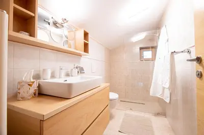 a bathroom with a sink and a toilet at Villa Azul in Kojsko