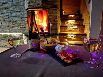 a table with two glasses and a bottle of wine at Holiday home in Trebnje Kranjska Krain 42897 in Trebnje