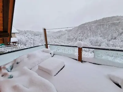 a balcony covered in snow with a view at Holiday home in Trebnje Kranjska Krain 42897 in Trebnje