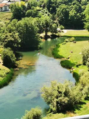 a river with a person in a boat in it at Holiday home in Dvor Kranjska Krain 42901 in Dvor