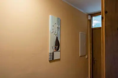 a picture of a vase of flowers on a wall at Holiday home in Dvor Kranjska Krain 42901 in Dvor