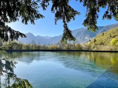 a view of a lake with mountains in the background at Apartma Bovec Center in Bovec