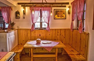 a kitchen with a wooden table in a room at Holiday home in Otocec Kranjska Krain 42903 in Otočec
