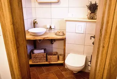 a small bathroom with a toilet and a sink at Holiday home in Otocec Kranjska Krain 42903 in Otočec