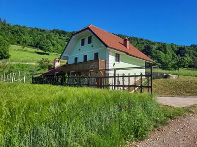 a house on top of a field with a fence at Holiday home in Semic Kranjska Krain 42896 in Semič