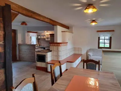 a kitchen and living room with a table and chairs at Holiday home in Semic Kranjska Krain 42896 in Semič