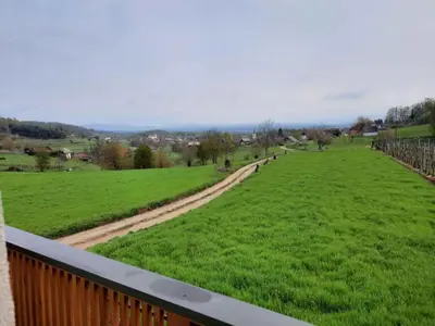 a view of a green field from a balcony at Holiday home in Semic Kranjska Krain 42896 in Semič