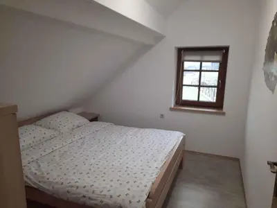 a small bedroom with a bed and a window at Holiday home in Semic Kranjska Krain 42896 in Semič