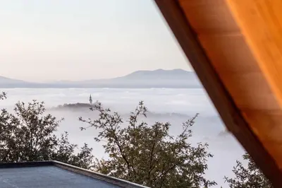 a view from the window of a house looking down at the clouds at Holiday home in Otocec Kranjska Krain 42907 in Otočec