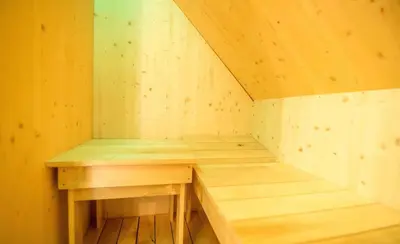 a small wooden sauna with a wooden bench in it at Holiday home in Otocec Kranjska Krain 42907 in Otočec