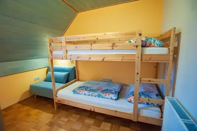 a bunk bed room with two bunk beds at Country House & Spa in Mislinja