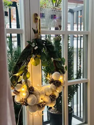 a christmas wreath on a window with lights at Top view residence in central Ljubljana in Ljubljana