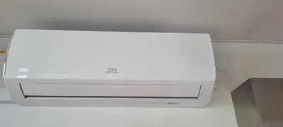 a white dvd player is hanging from a ceiling at Thomas apartment 028 in Ljubljana