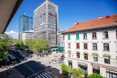 an overhead view of a city with tall buildings at Central View Point Apartment in Ljubljana