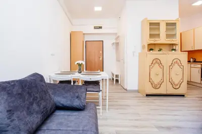 a living room with a couch and a table at Central View Point Apartment in Ljubljana