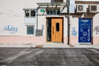 a door on a building with graffiti on it at Central View Point Apartment in Ljubljana